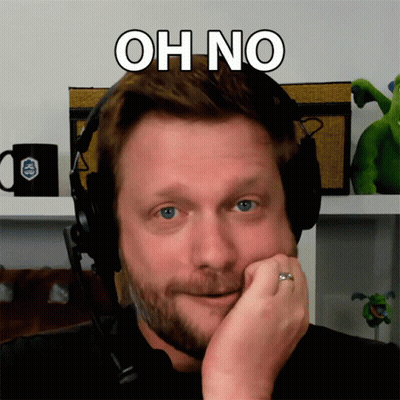 A Man Wearing Headphones With The Words Oh No Written Above His Head GIF