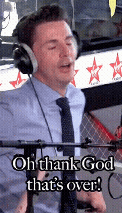 A Man Wearing Headphones With The Words Oh Thank God That 'S Over GIF