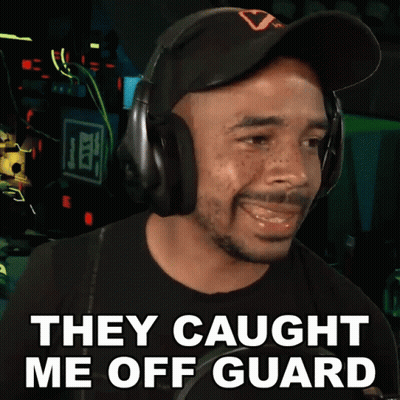 A Man Wearing Headphones With The Words They Caught Me Off Guard GIF