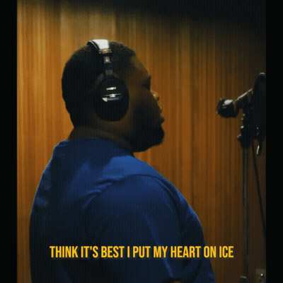 A Man Wearing Headphones With The Words Think It 'S Best I Put My Heart On Ice Above Him GIF