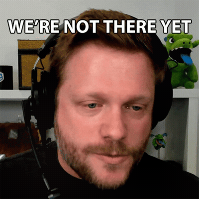 A Man Wearing Headphones With The Words We 'Re Not There Yet Above Him GIF