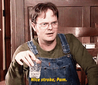 A Man Wearing Overalls Is Holding A Shot Glass And Says Nice Stroke Pam GIF