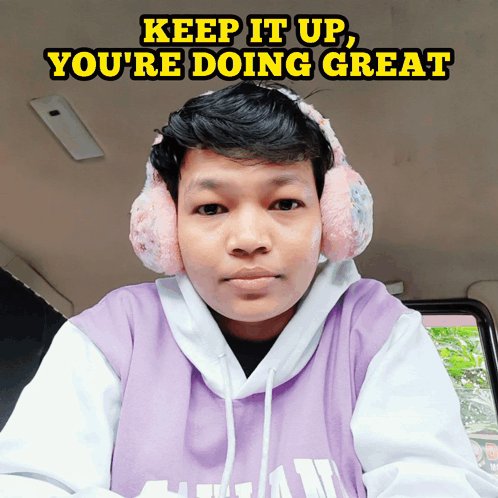 A Man Wearing Pink Ear Muffs And A Purple Hoodie With The Words Keep It Up You 'Re Doing Great GIF