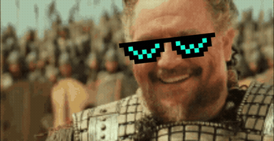 A Man Wearing Pixelated Sunglasses With The Letter W On Them Smiles GIF