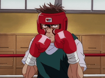 A Man Wearing Red Boxing Gloves And A Red Helmet With The Letter Z On It GIF