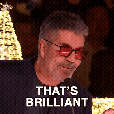 A Man Wearing Red Glasses And A Suit Says That 'S Brilliant GIF