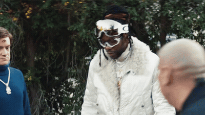A Man Wearing Ski Goggles With The Letter C On The Side GIF