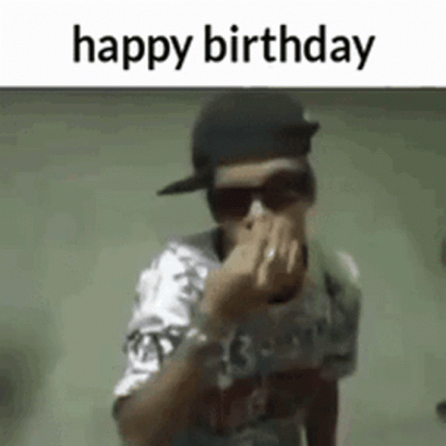 A Man Wearing Sunglasses And A Baseball Cap Is Covering His Nose With His Hand . GIF