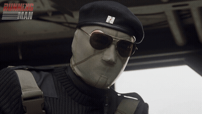 A Man Wearing Sunglasses And A Beret With The Letter N On It Is In Front Of A Running Man Poster GIF