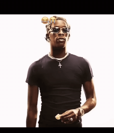 A Man Wearing Sunglasses And A Black Shirt Has A Cross Necklace GIF