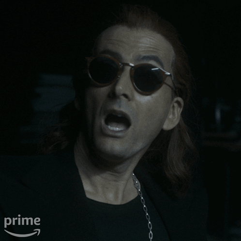 A Man Wearing Sunglasses And A Black Shirt Says " Not Yet " On The Bottom GIF