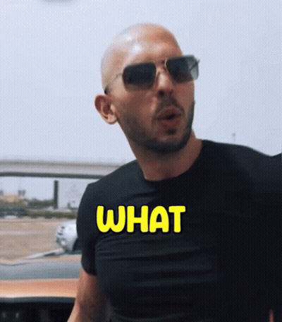 A Man Wearing Sunglasses And A Black Shirt That Says What On It GIF