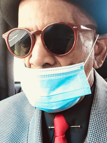 A Man Wearing Sunglasses And A Blue Mask GIF