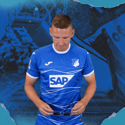 A Man Wearing Sunglasses And A Blue Shirt That Says Sap On It GIF