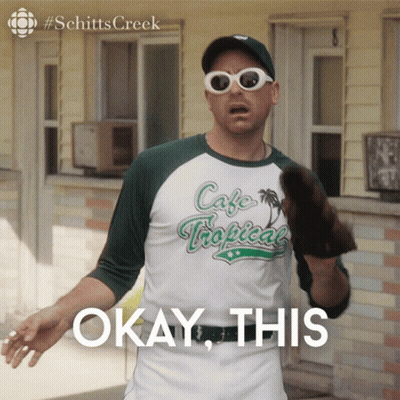 A Man Wearing Sunglasses And A Cafe Tropical Shirt Says " Okay This " GIF