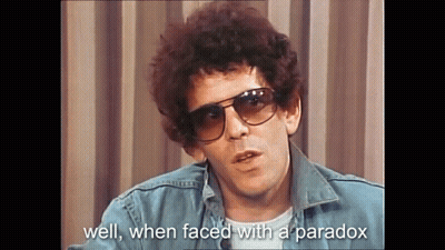 A Man Wearing Sunglasses And A Denim Jacket Is Talking About Well When Faced With A Paradox GIF