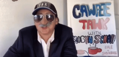 A Man Wearing Sunglasses And A Fbi Hat Is Standing In Front Of A Sign That Says Cawee Talk GIF