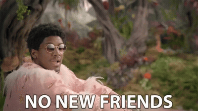 A Man Wearing Sunglasses And A Feathered Cape Says " No New Friends " GIF