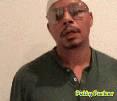 A Man Wearing Sunglasses And A Green Shirt With Patty Parker Written In Yellow GIF