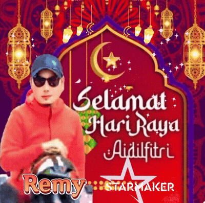 A Man Wearing Sunglasses And A Hat Is Standing In Front Of A Red Sign That Says Selamat Hari Raya Aidilfitri GIF