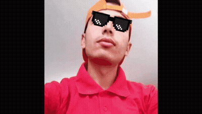A Man Wearing Sunglasses And A Hat Looks Up At The Sky GIF