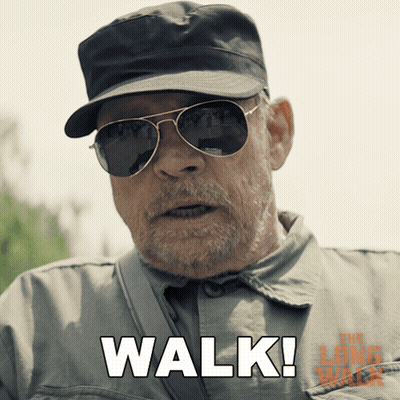 A Man Wearing Sunglasses And A Hat Says " Walk " In White Letters GIF