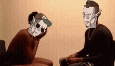 A Man Wearing Sunglasses And A Hat With The Word Vans On It Is Sitting Next To Another Man Wearing Sunglasses GIF
