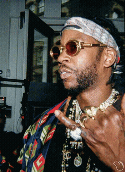 A Man Wearing Sunglasses And A Headband With A Gucci Logo GIF
