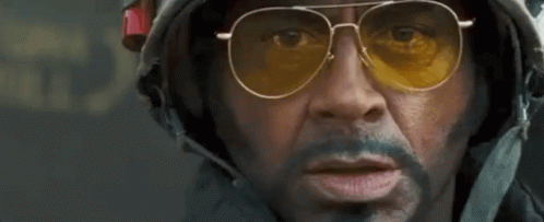 A Man Wearing Sunglasses And A Helmet With The Words Survive Written In Red GIF