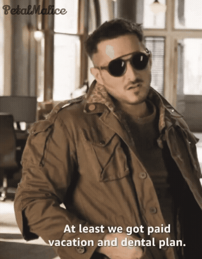 A Man Wearing Sunglasses And A Jacket With The Words At Least We Got Paid Vacation And Dental Plan GIF
