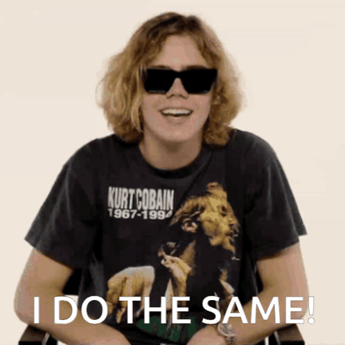 A Man Wearing Sunglasses And A Kurt Cobain 1967-1994 Shirt Says I Do The Same GIF