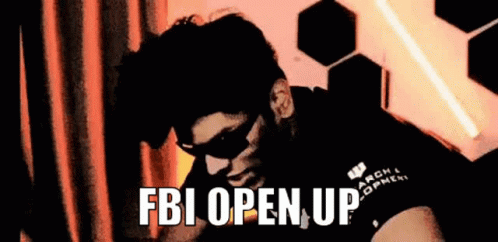 A Man Wearing Sunglasses And A Mask Is Saying `` Fbi Open Up '' While Looking Down . GIF