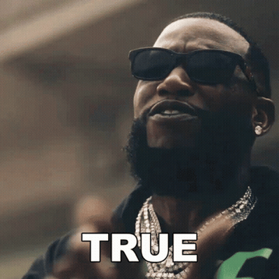 A Man Wearing Sunglasses And A Necklace Has The Word True Above Him GIF