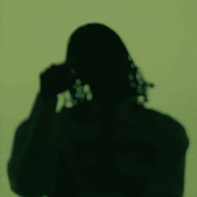 A Man Wearing Sunglasses And A Shirt That Says ' A ' On It GIF