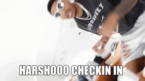 A Man Wearing Sunglasses And A Shirt That Says ' Harshooo Checkin In ' On It . GIF