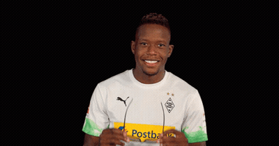 A Man Wearing Sunglasses And A Shirt That Says Postbank On It GIF