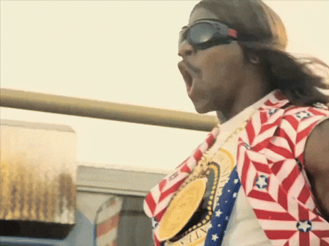 A Man Wearing Sunglasses And A Shirt That Says ' United States ' On It GIF