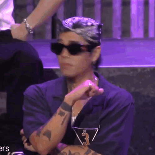 A Man Wearing Sunglasses And A Shirt With The Number 3 GIF