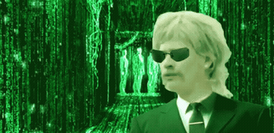 A Man Wearing Sunglasses And A Suit And Tie Is Standing In Front Of A Green Background . GIF