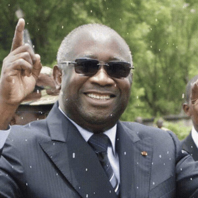 A Man Wearing Sunglasses And A Suit Is Smiling And Giving A Thumbs Up GIF