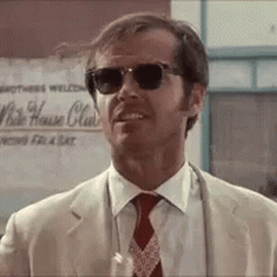 A Man Wearing Sunglasses And A Suit Is Standing In Front Of A Sign That Says White House Club GIF