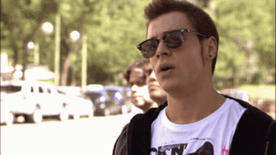 A Man Wearing Sunglasses And A T-Shirt That Says " A Tres Dias " On It GIF