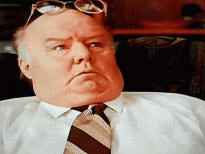 A Man Wearing Sunglasses And A Tie Makes A Serious Face GIF