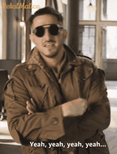 A Man Wearing Sunglasses And A Trench Coat Says Yeah Yeah Yeah Yeah GIF