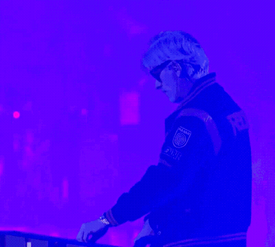 A Man Wearing Sunglasses And A Varsity Jacket That Says Power On The Back GIF