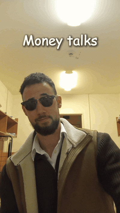 A Man Wearing Sunglasses And A Vest With The Words Money Talks Behind Him GIF