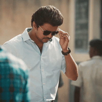A Man Wearing Sunglasses And A Watch Adjusts His Sunglasses GIF
