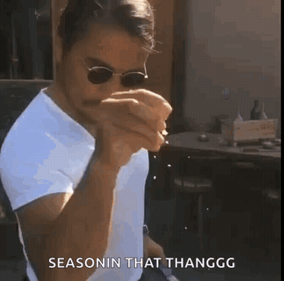 A Man Wearing Sunglasses And A White Shirt Is Smoking A Cigarette And Says Seasonin That Thanggg . GIF