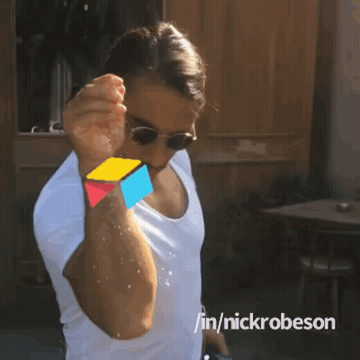 A Man Wearing Sunglasses And A White Shirt Is Spraying Water On Himself With The Hashtag Nickrobeson GIF