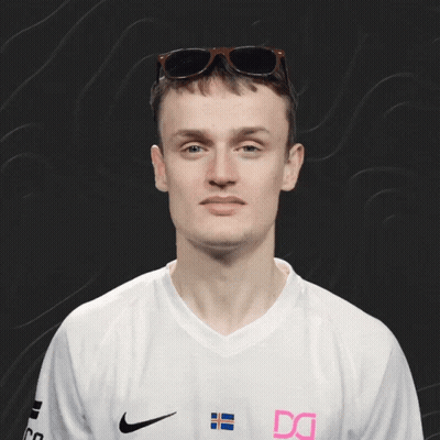 A Man Wearing Sunglasses And A White Shirt With The Letter Dg On It GIF